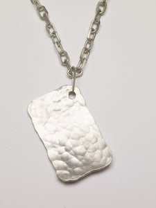 Hand hammered sterling silver dog tag
