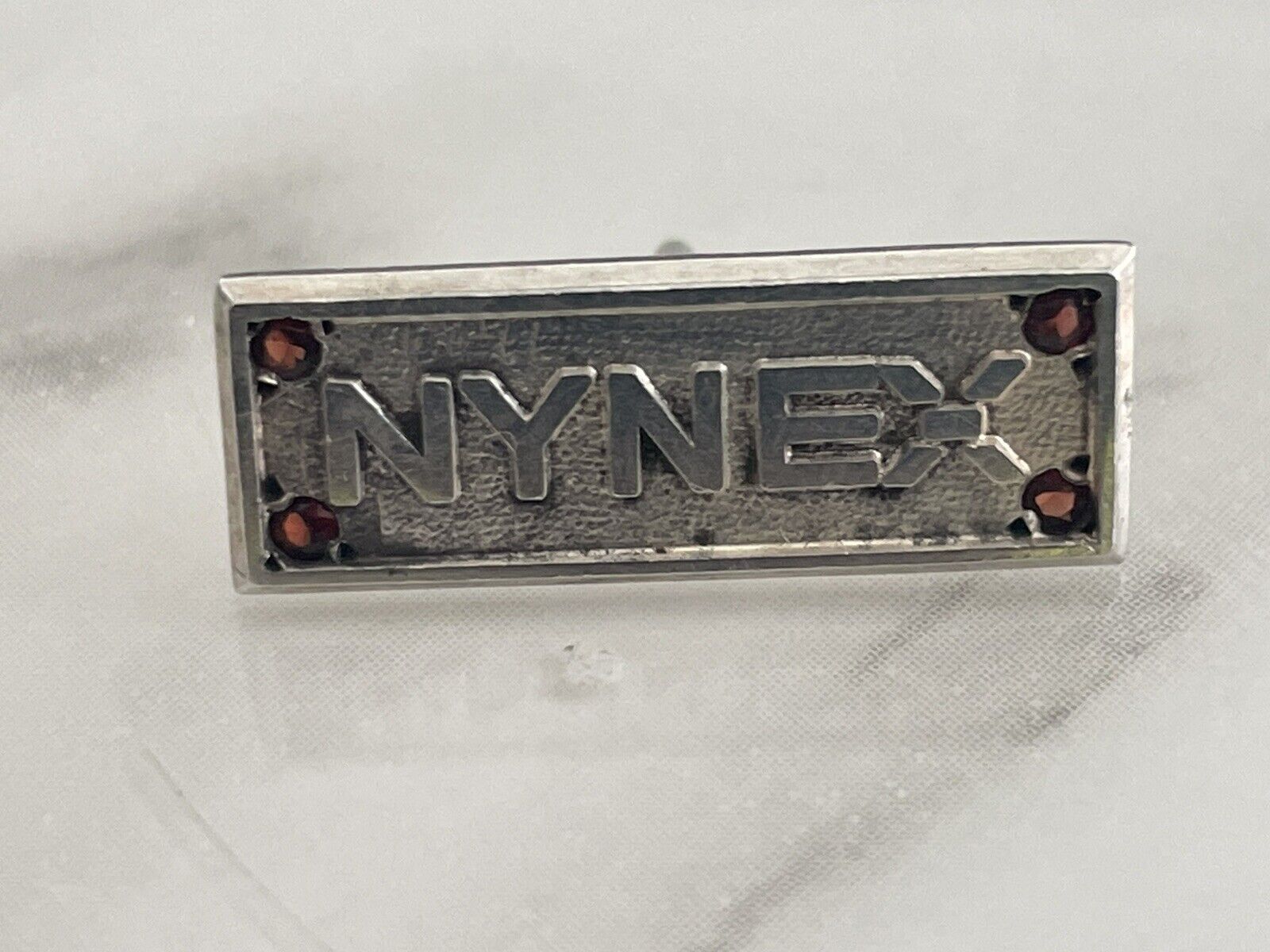 Tiffany & Co NYNEX employee Tie Tack Lapel Pin Sterling Silver with Garnets